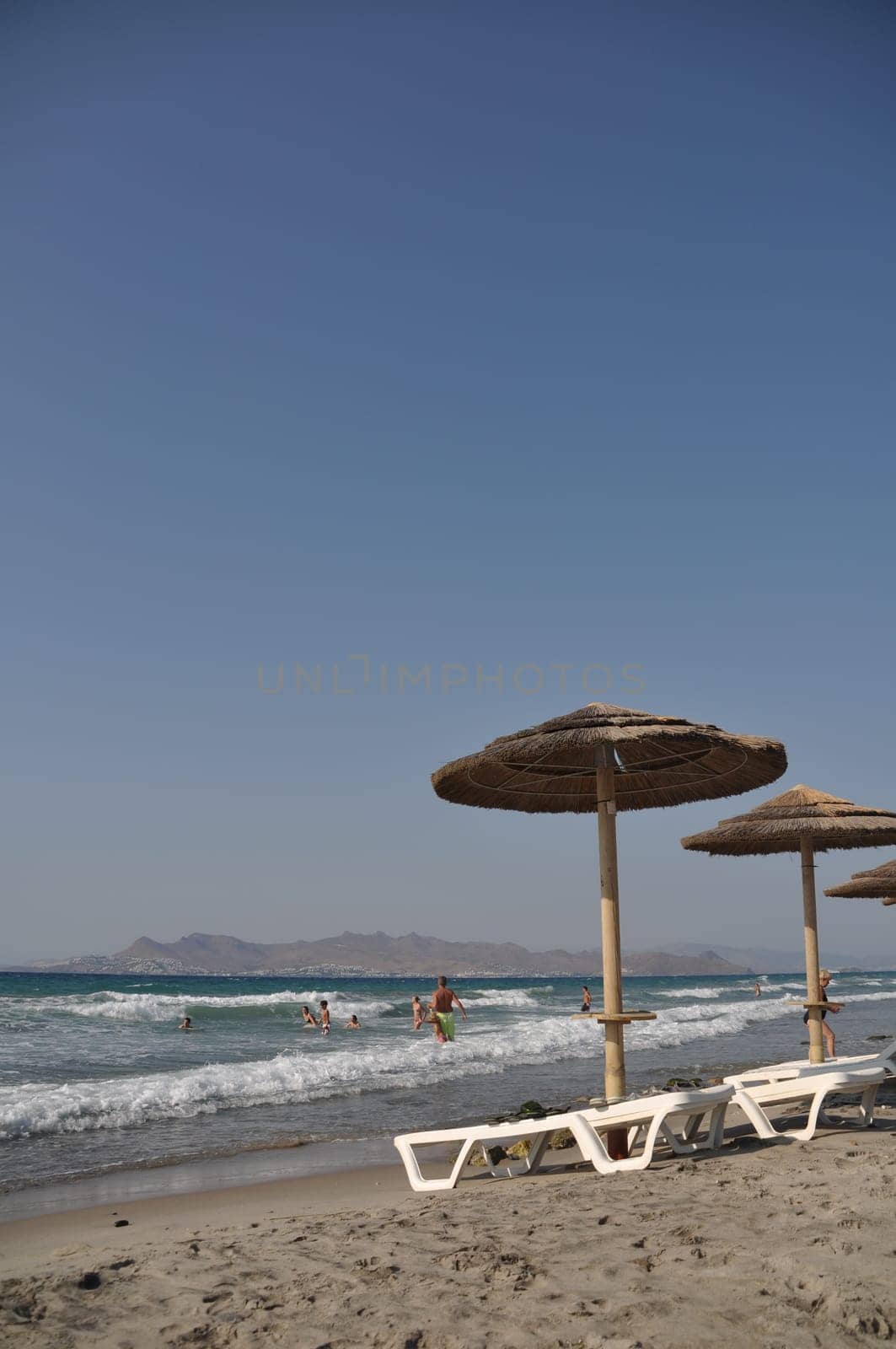 KOS - AUGUST 22 2010: beautiful beach in Kos, Greece (Turkey on the background) August 22, 2010 in Kos, GREECE