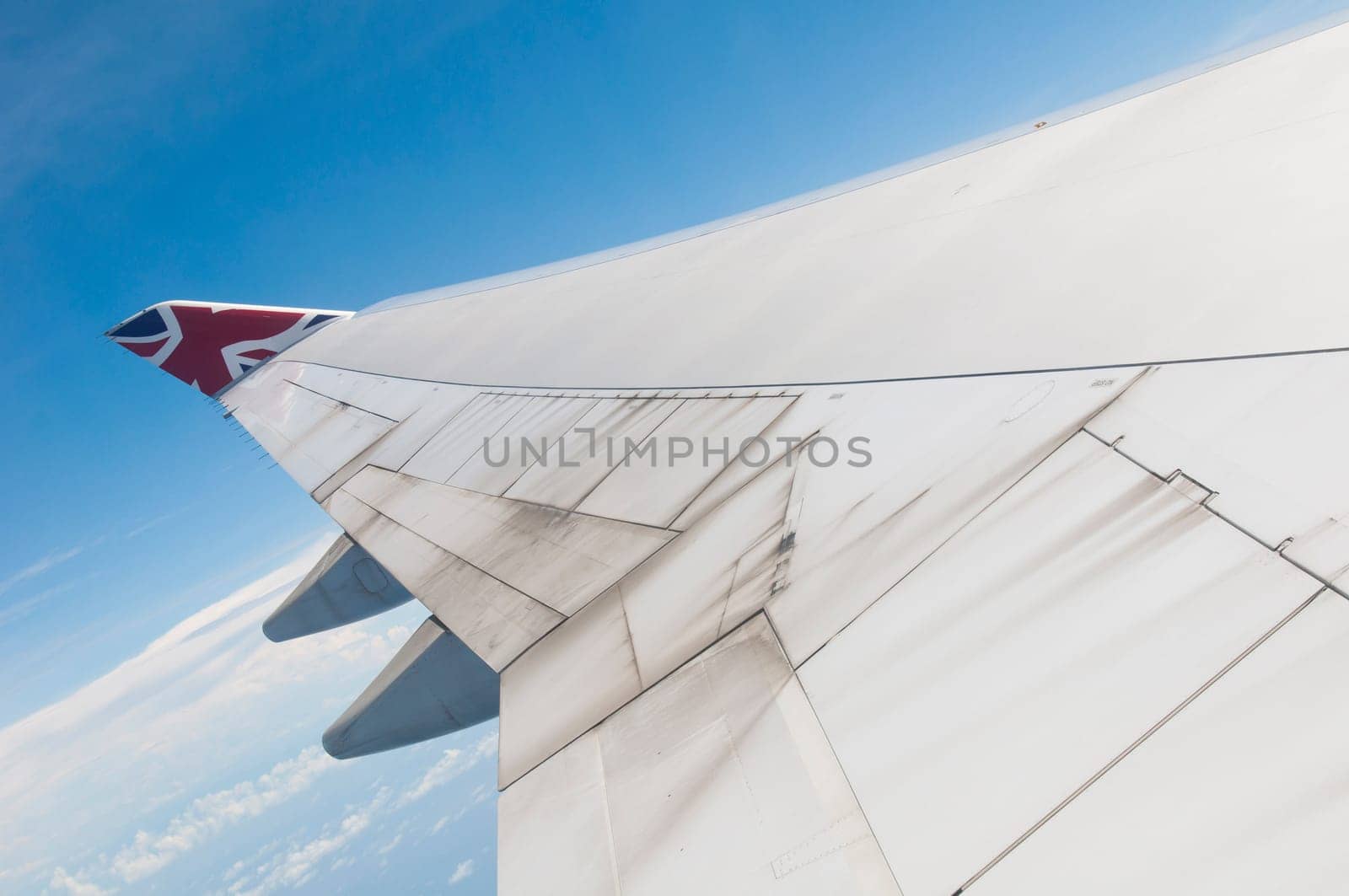 ST JOHNS, ANTIGUA - AUGUST 17: view of Boeing 747 wing of Virgin Atlantic Airways with blue sky clouds close to V. C. Bird International Airport in Antigua on August 17, 2011 in St. John&#039 s, Antigua