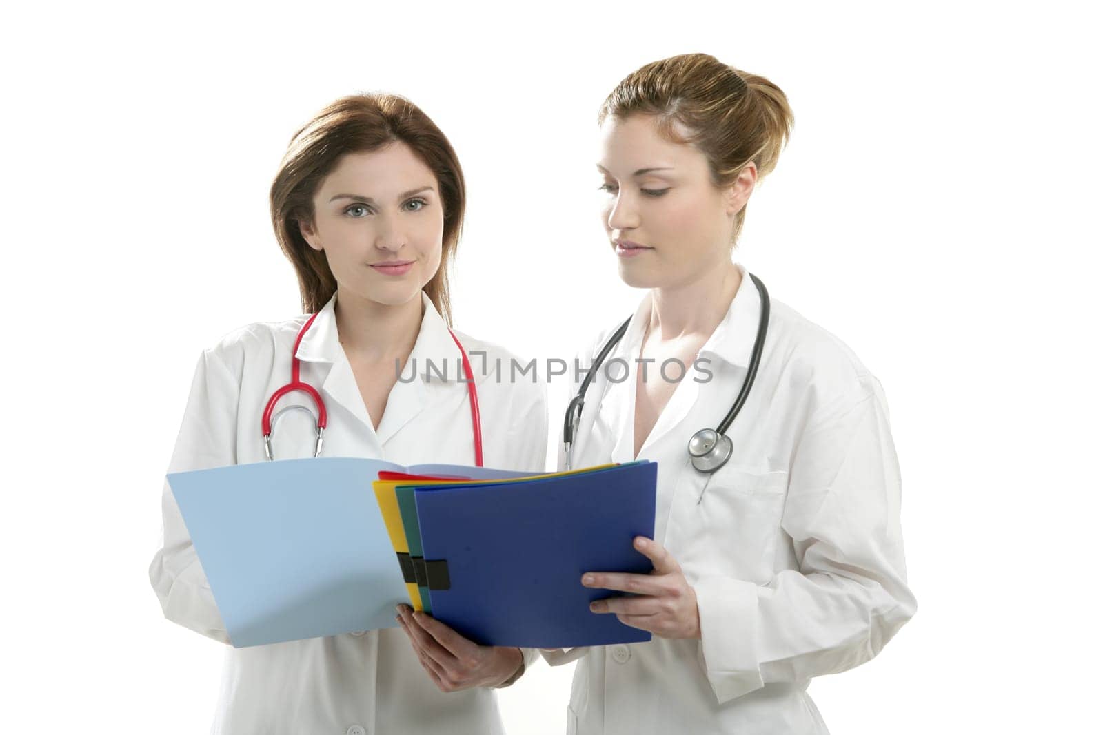 Two doctor women isolated on white studio background