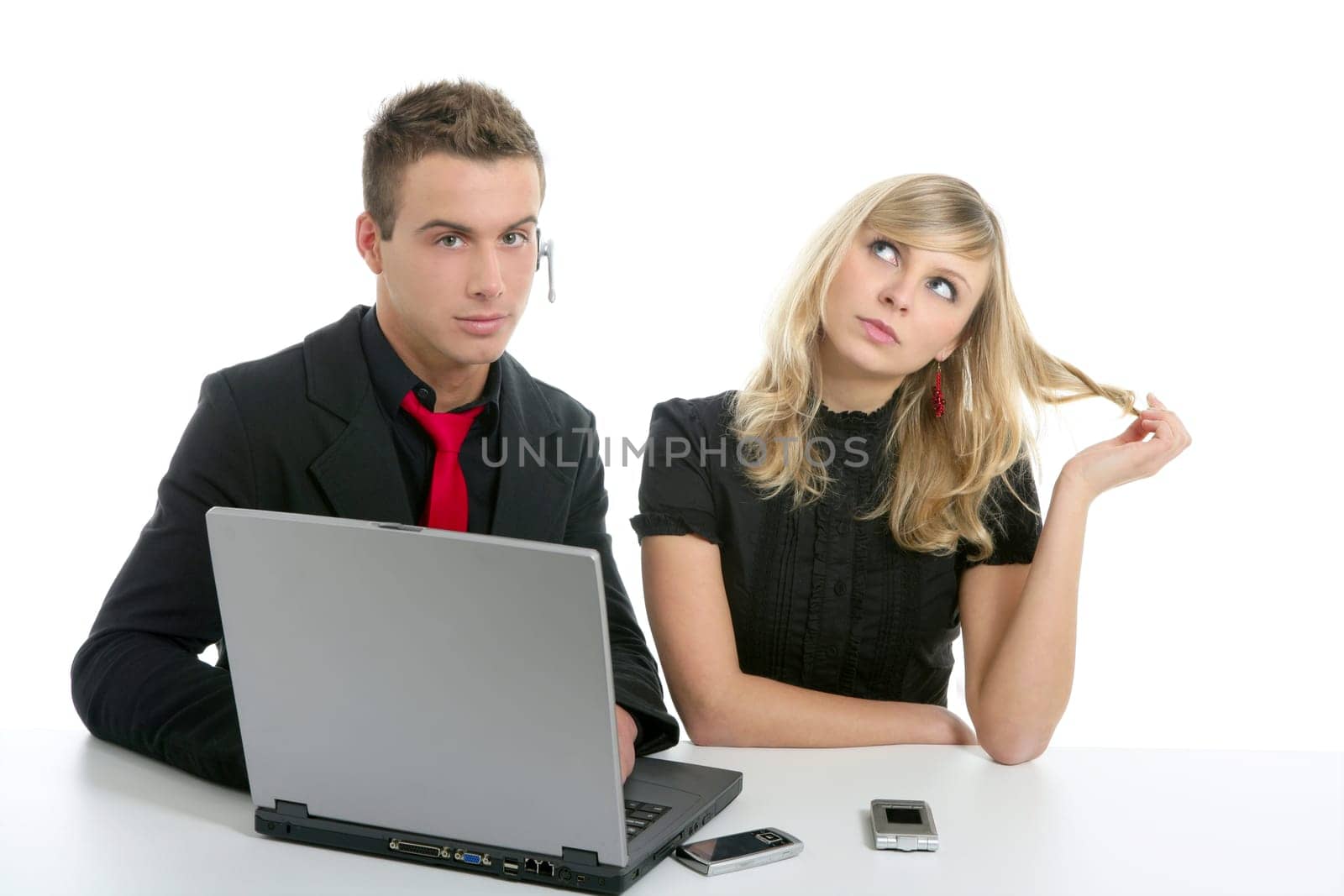 Young business couple dress in black with laptop isolated on white