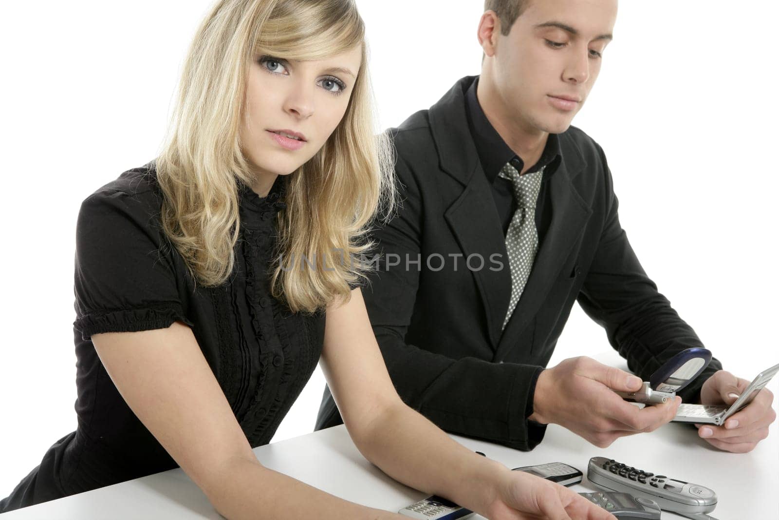 Helpdesk metaphor with many telephones. young business couple