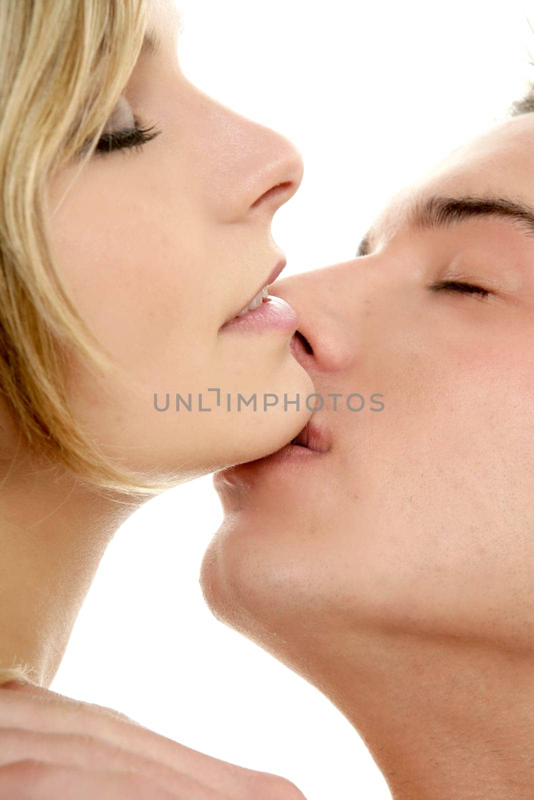 Kiss over white, young passion heterosexual couple