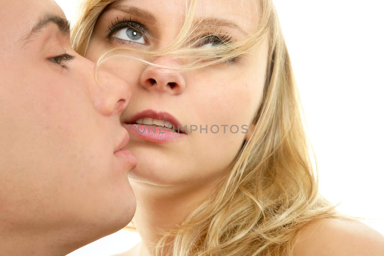 Couple natural kiss close up portrait over white background