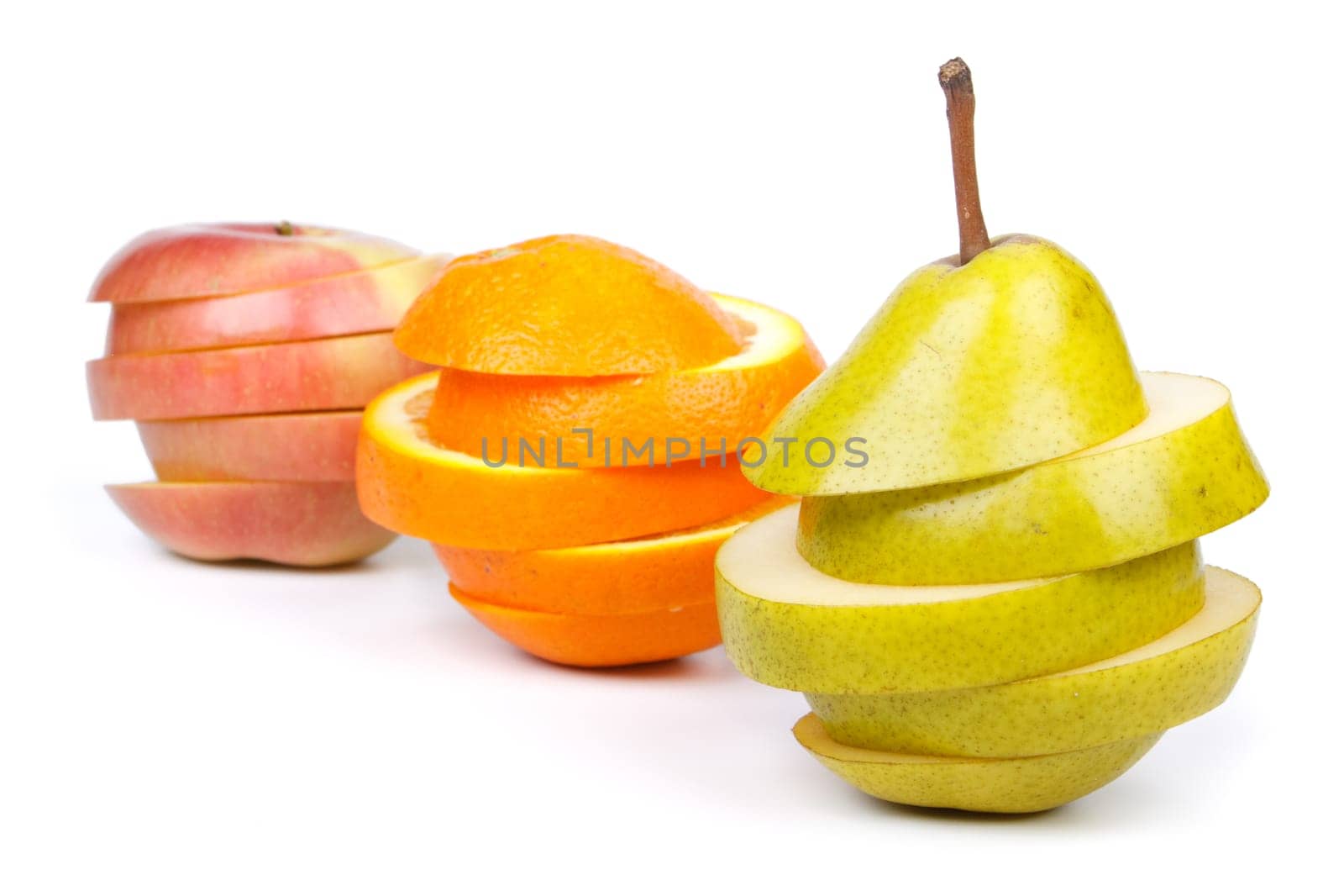Fresh sliced fruits on a white background. Close up.