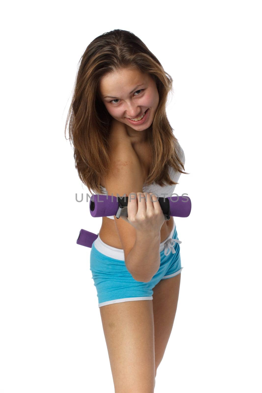 The beautiful sports girl with dumbbells on a white background. Training.