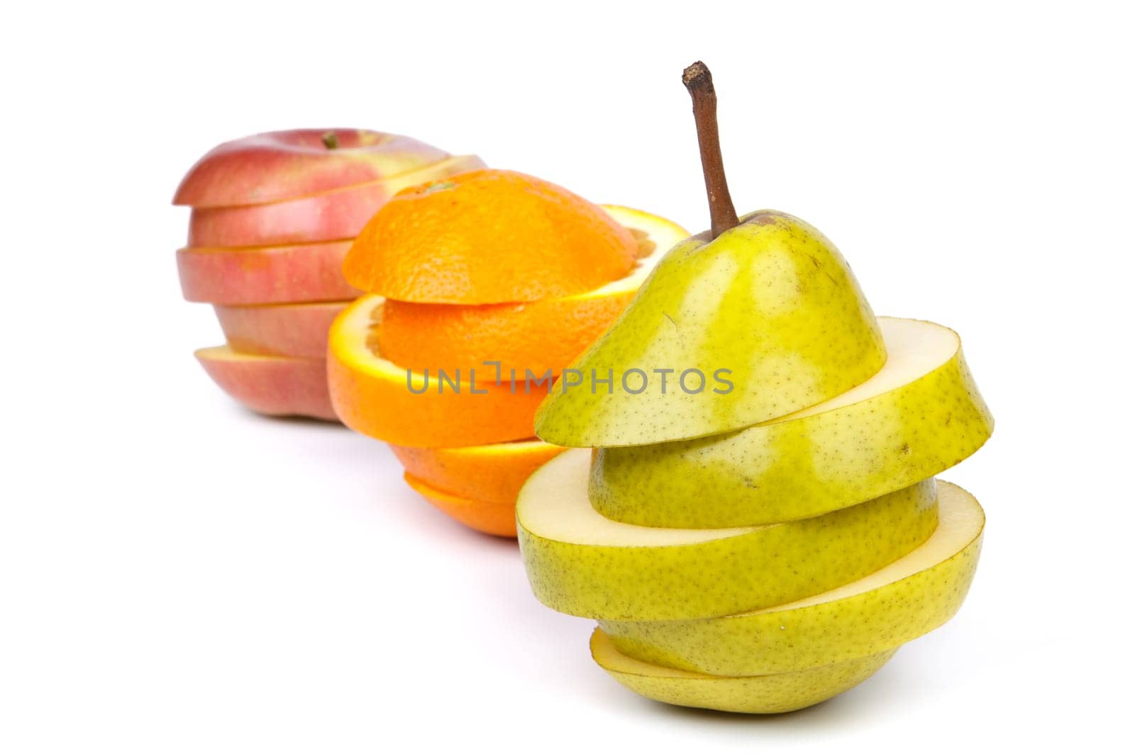Fresh sliced fruits on a white background. Close up.
