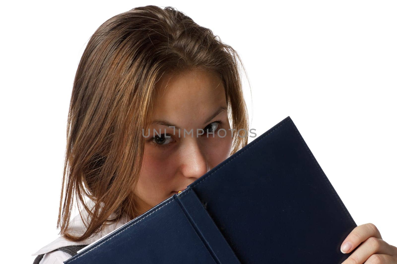 The beautiful young girl with a diary on a white background.