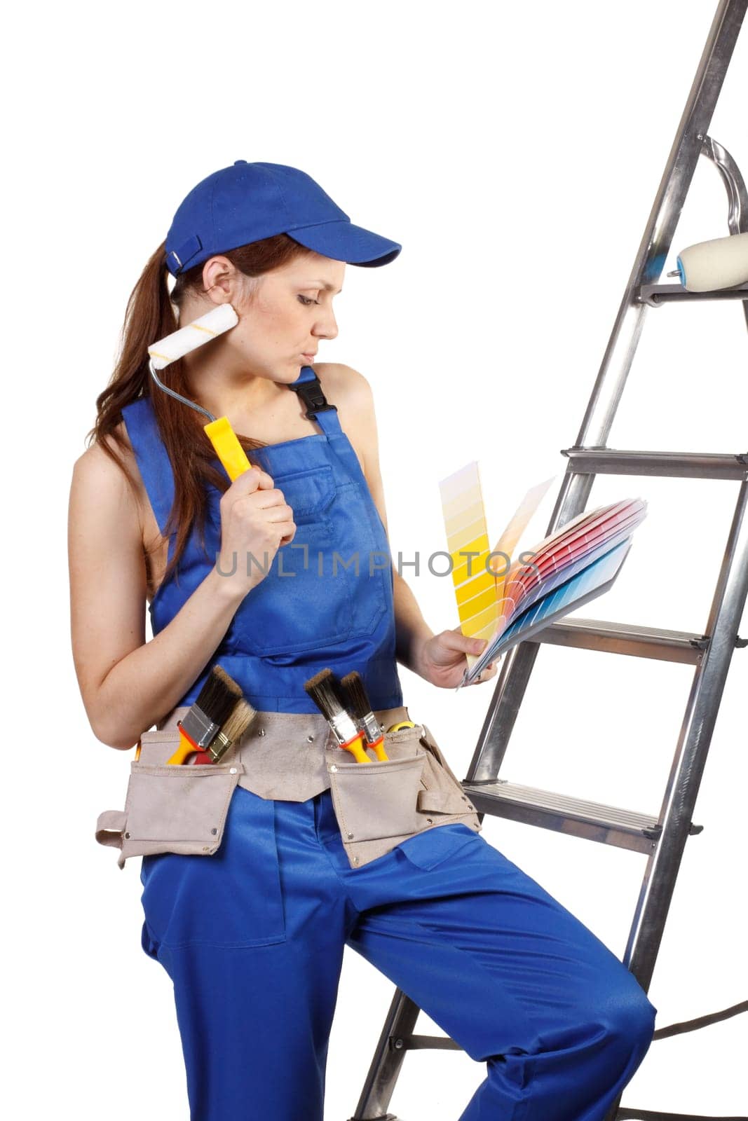 Female construction worker with palette in hands on a white background