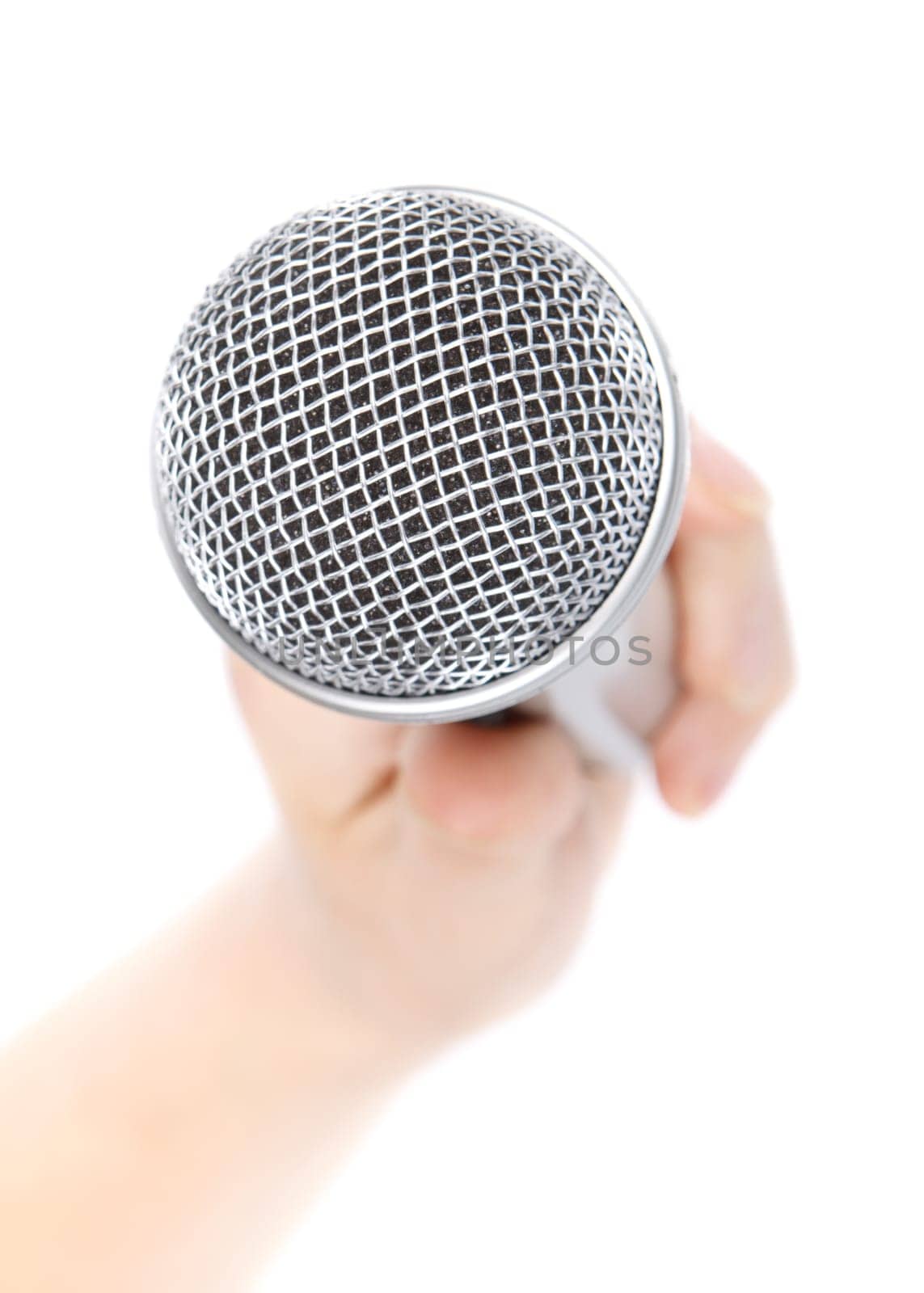 Silver microphone in a female hand on a white background.