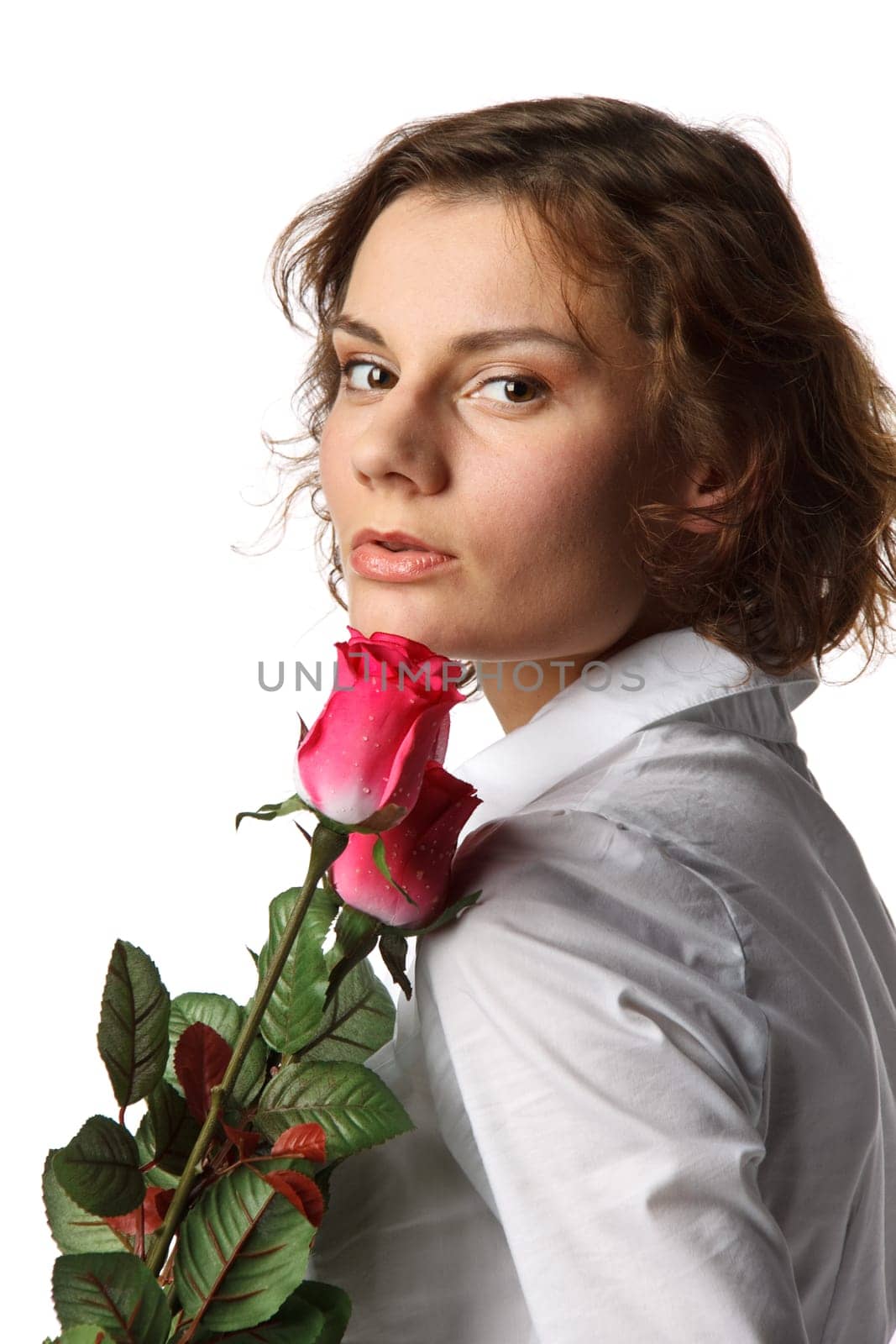 The beautiful girl with a bouquet of roses on a white background.