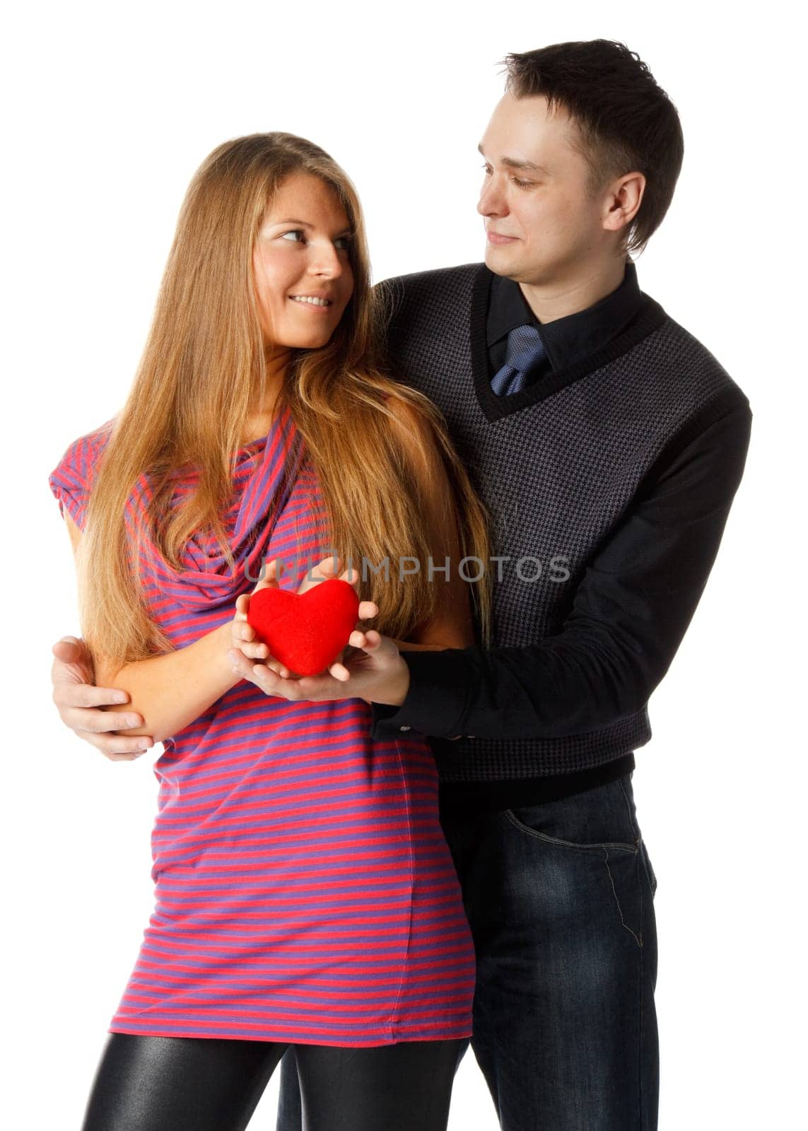 Young enamoured couple with a heart on a white background.