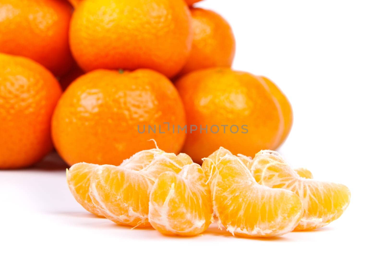 Fresh tangerines on a white background. Close up.