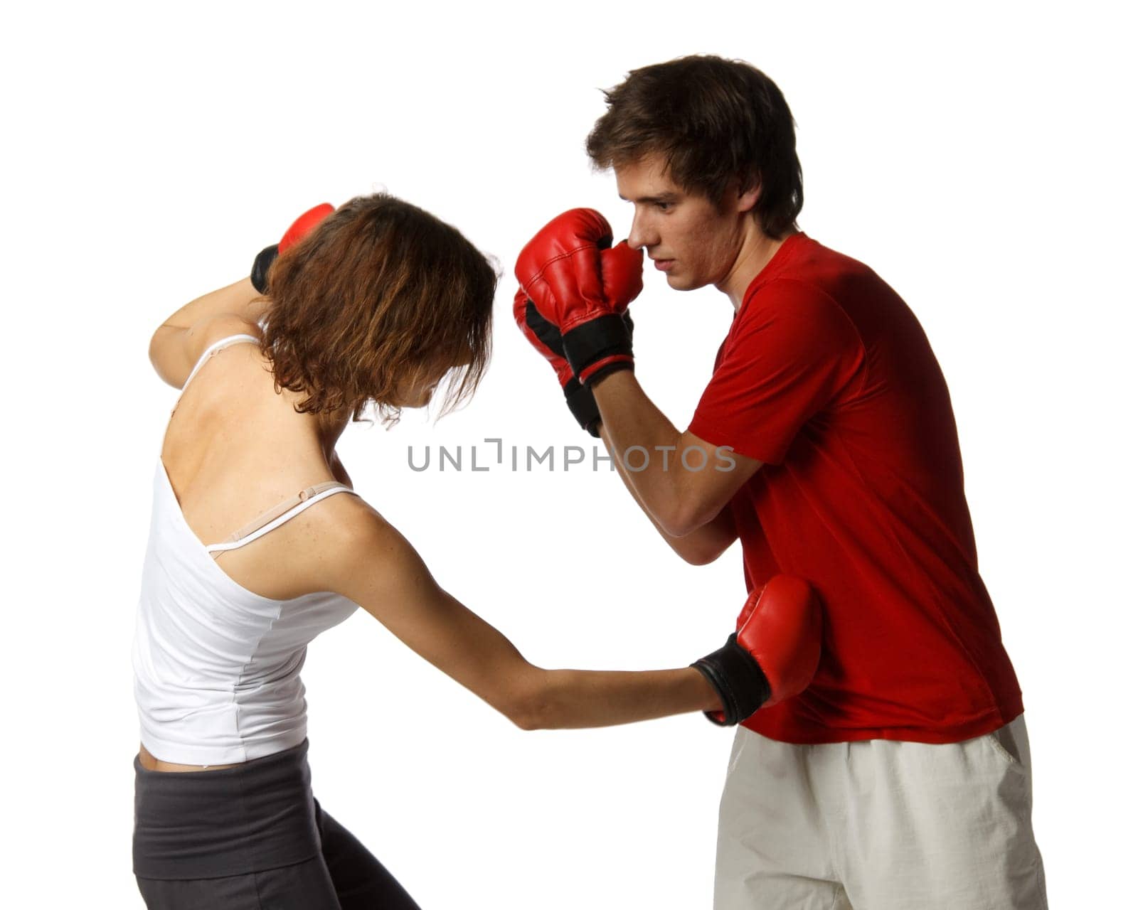Sporty couple in red fighting gloves on a white background.