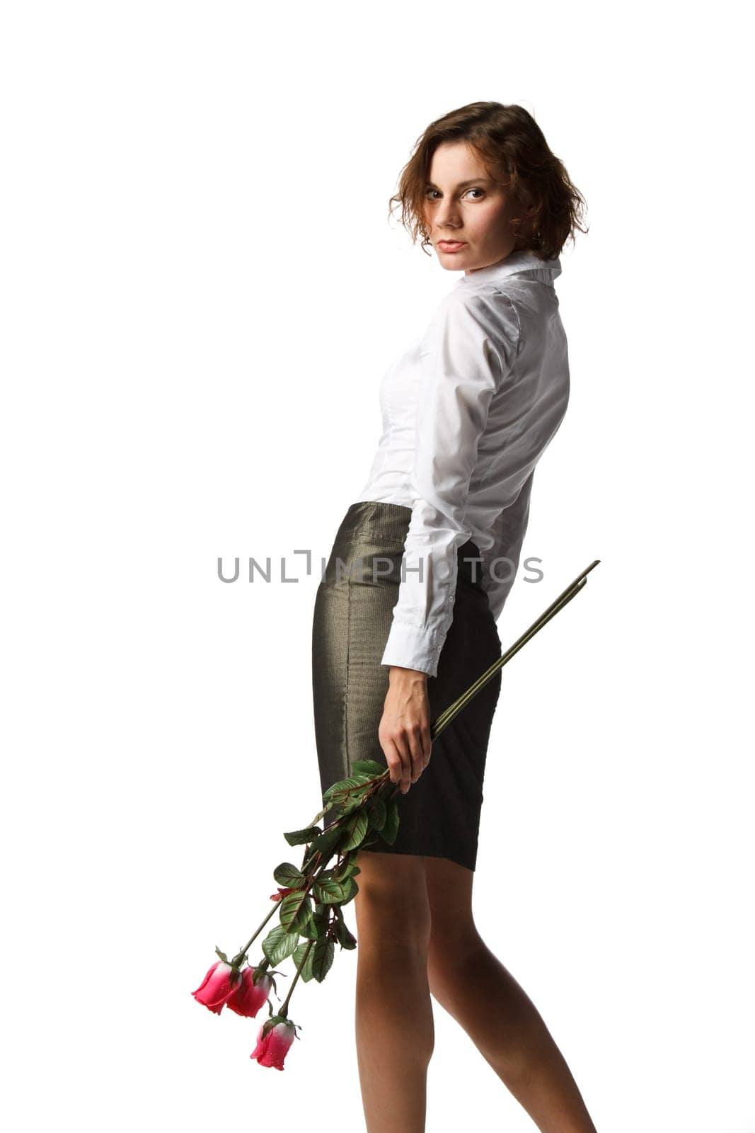 The beautiful girl with a bouquet of roses on a white background.