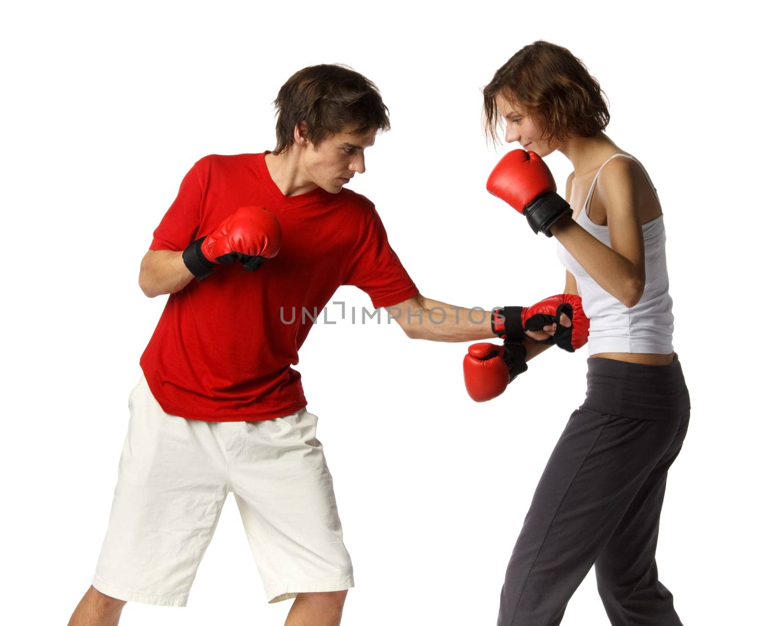 Sporty couple in red fighting gloves on a white background.