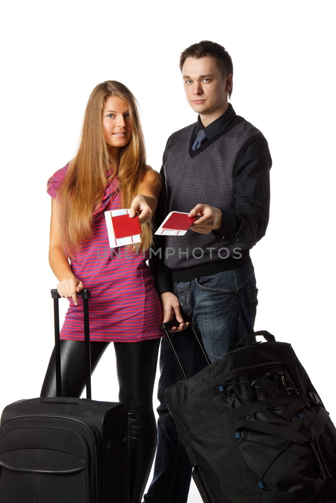 Happy young family with suitcases and tickets on a white background. Vacation.