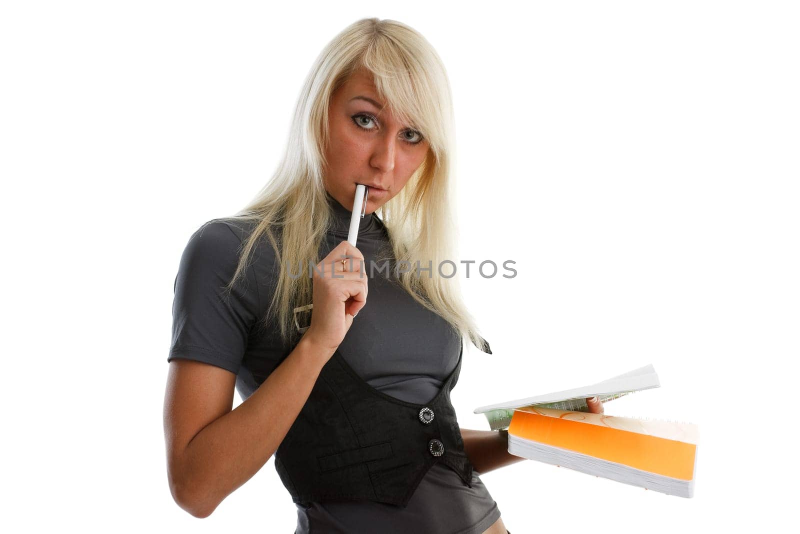 The beautiful girl stand with coloured writing-books on a white background. The student.