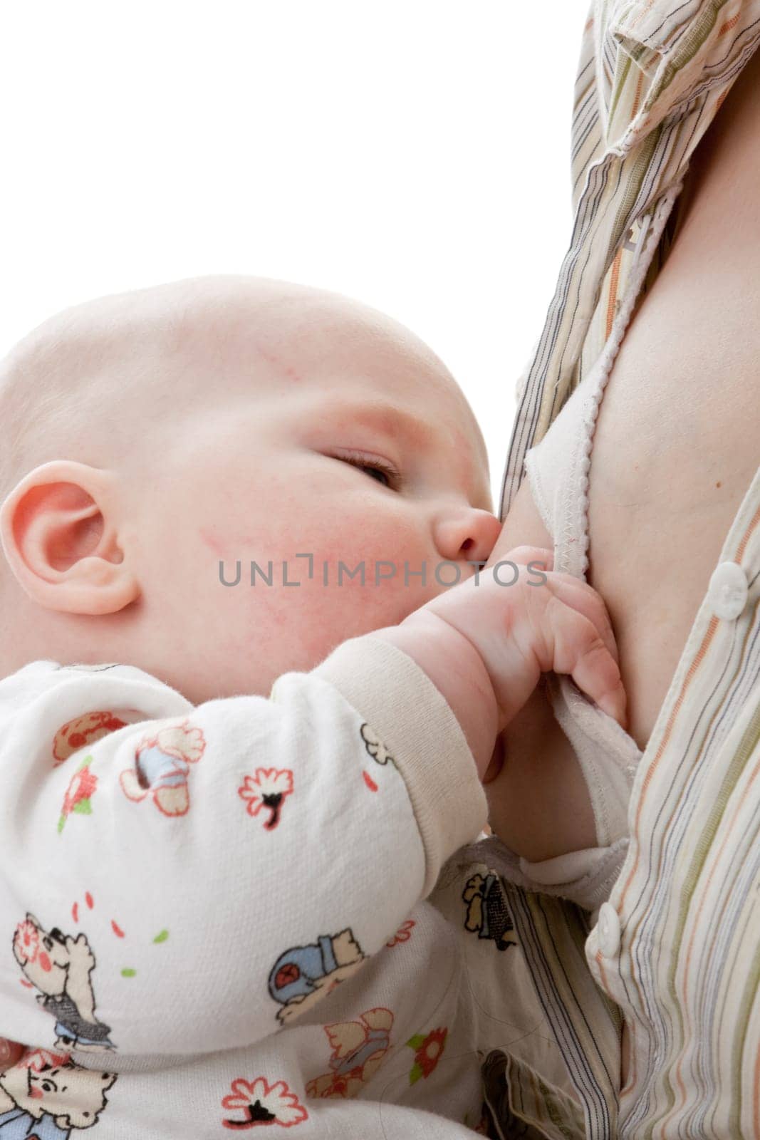 Young mum nurses the child on a white background