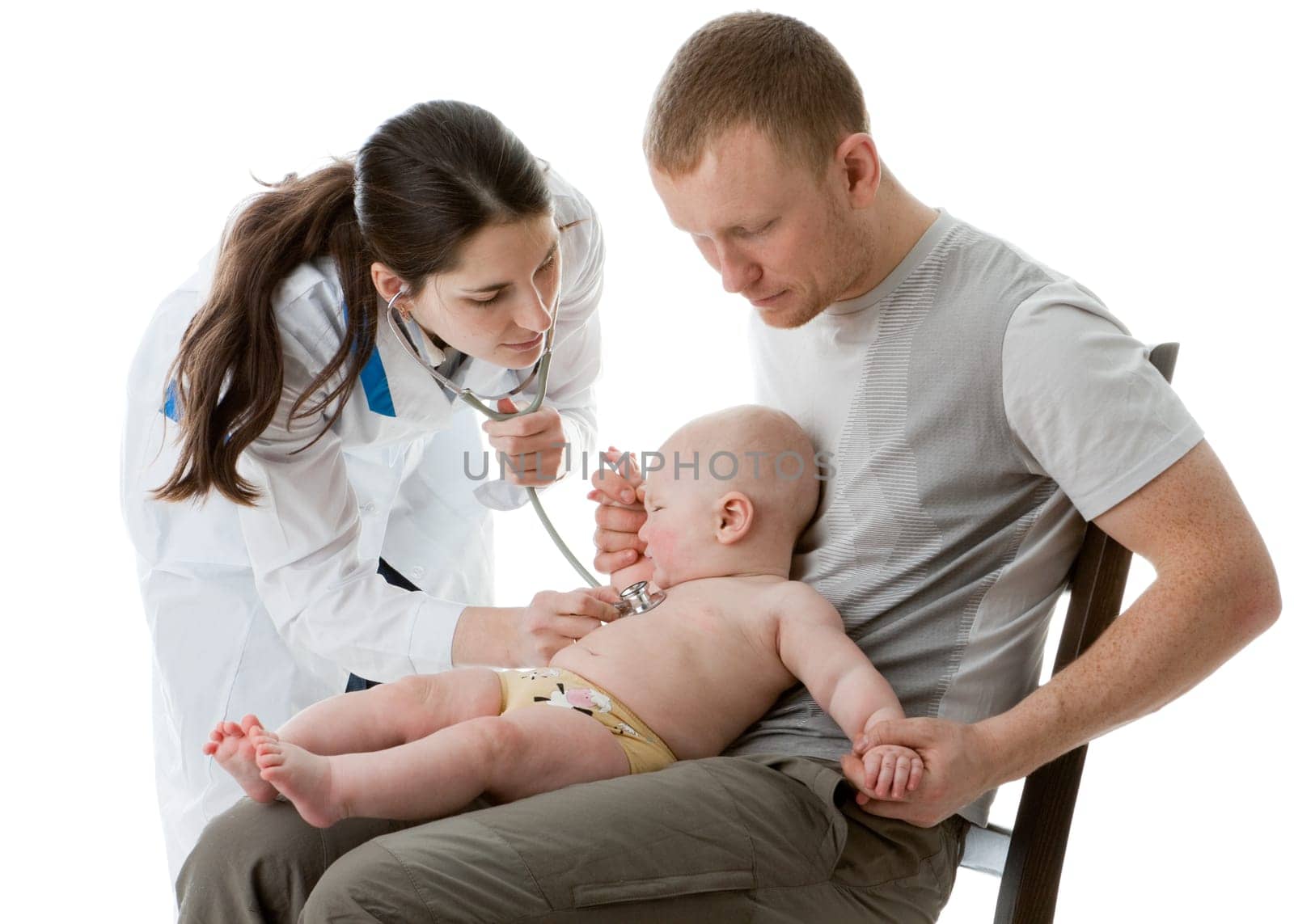 The female doctor with a stethoscope and the daddy with the small child on a white background.