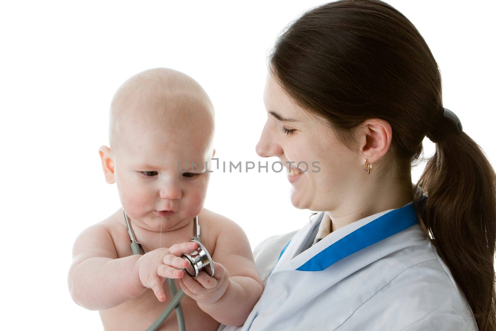 The female doctor with a stethoscope and the small patient on a white background.