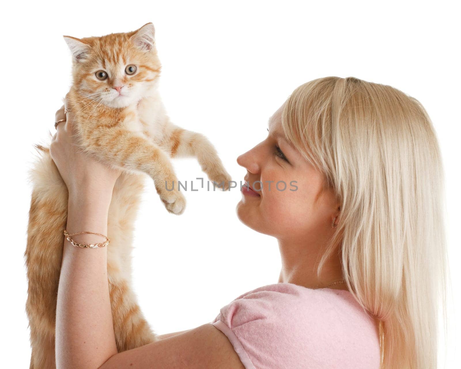 The happy young woman with a small amusing kitten on a white background.