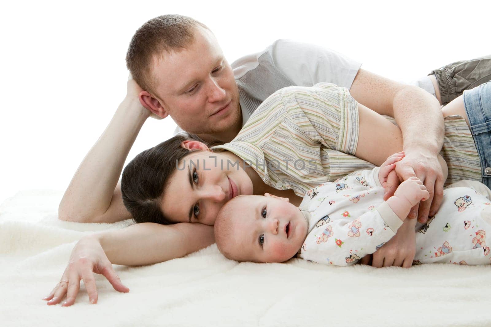 Happy family. Father, mother and sweet baby on a white background.