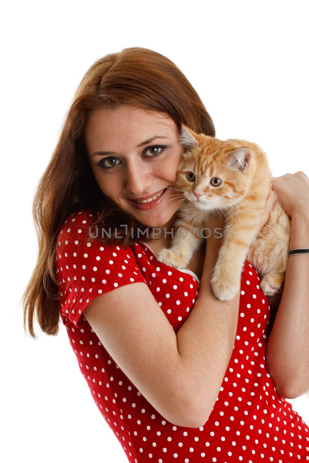 The happy young woman with a small amusing kitten on a white background.