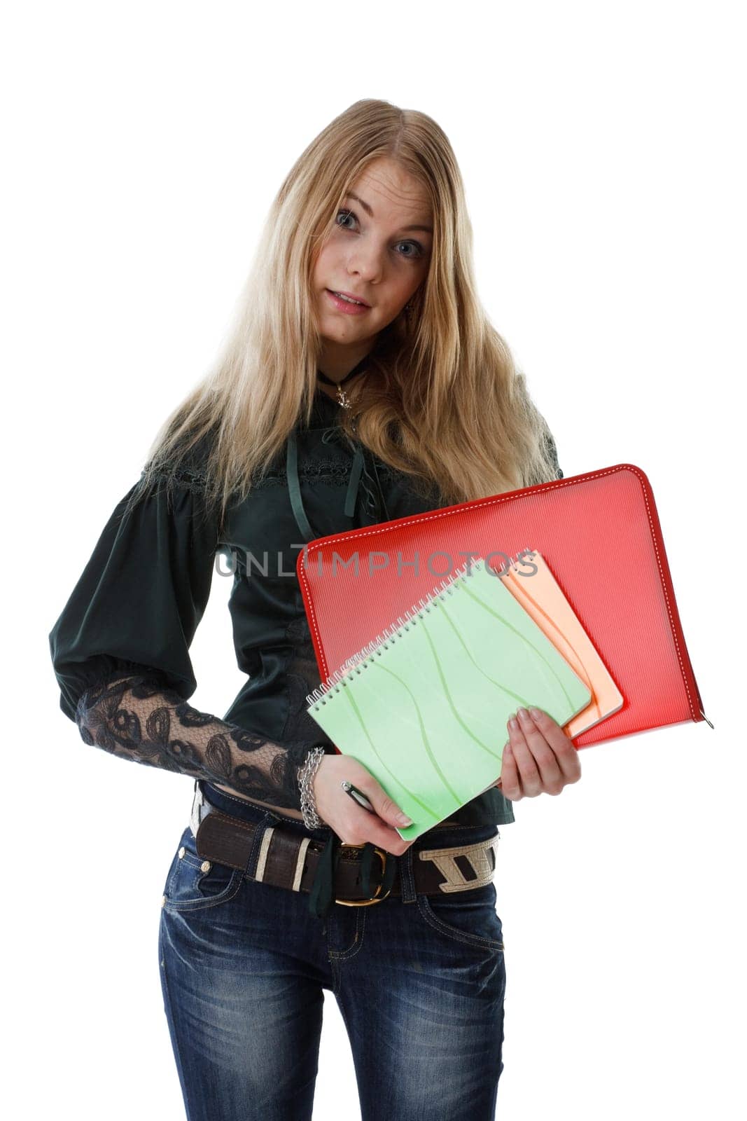 The beautiful girl stand with coloured writing-books on a white background. The student.