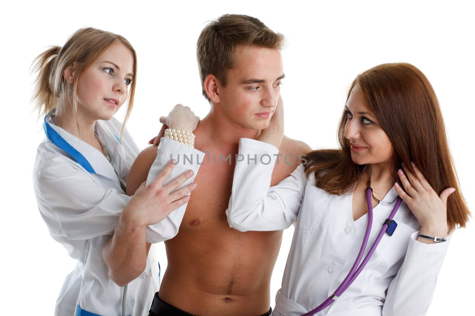 Two nurses and the young male patient on a white background.