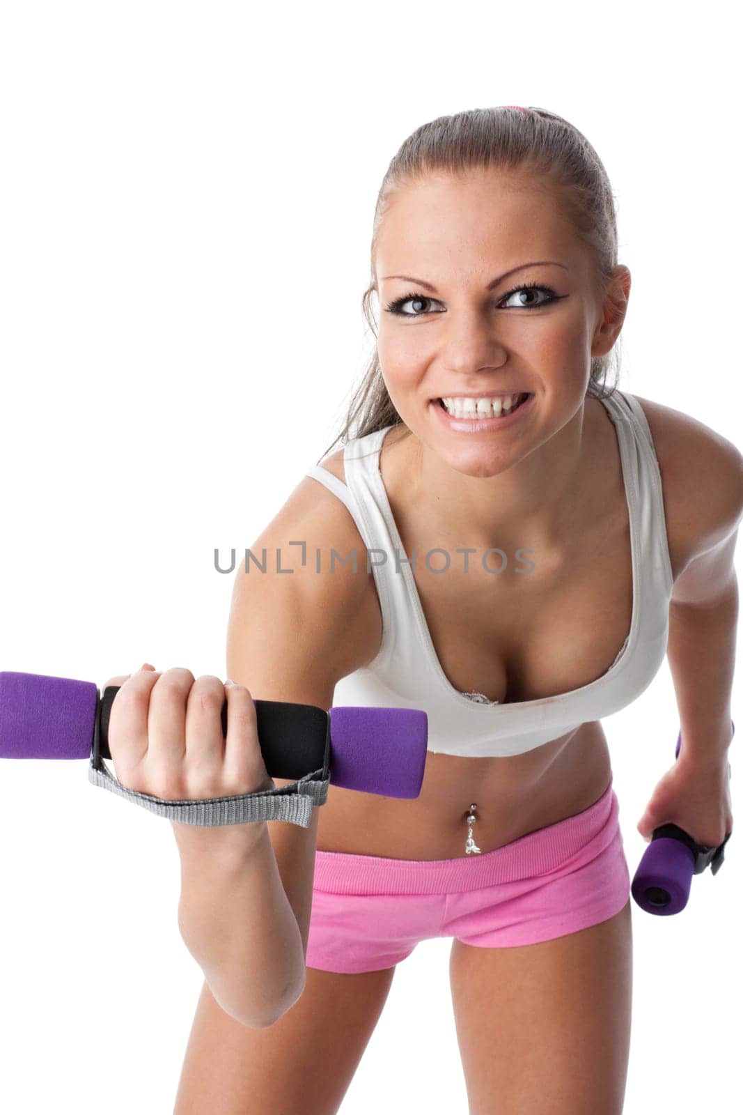 The beautiful sports girl with dumbbells on a white background. Training.