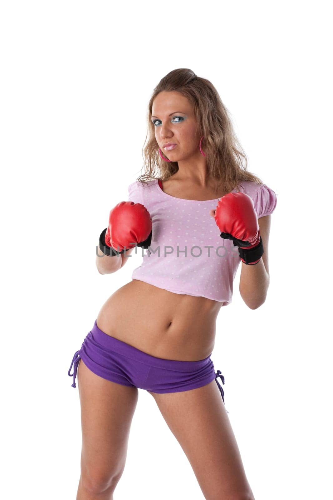 Sporty girl in red fighting gloves on a white background.