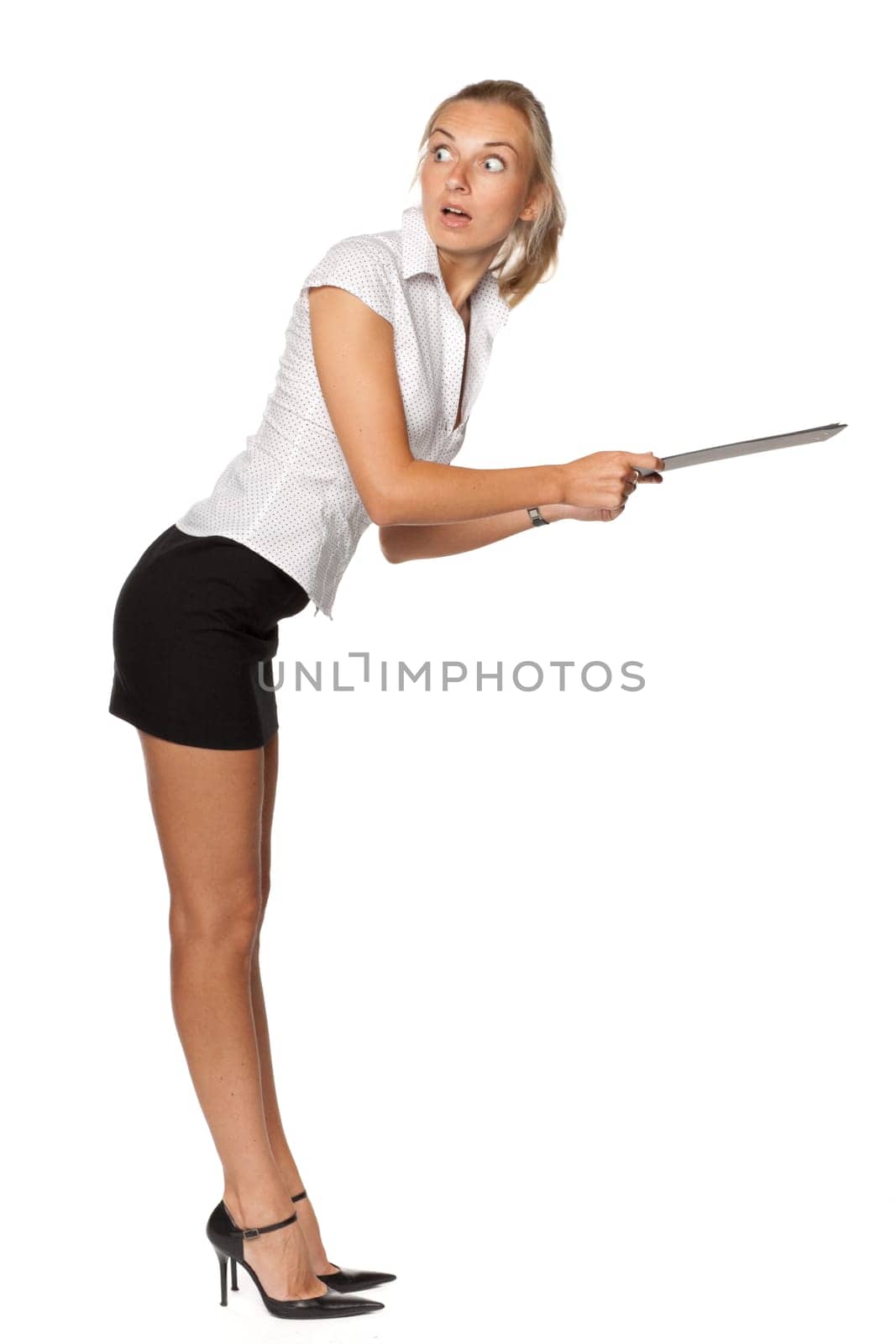The beautiful blonde stands with a clipboard in hands on a white background.
