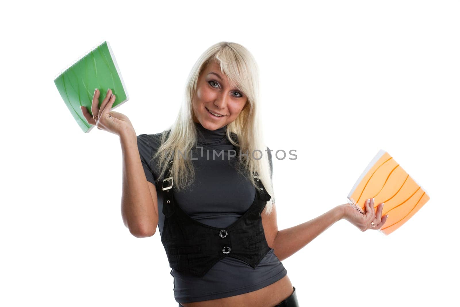 The beautiful girl stand with coloured writing-books on a white background. The student.