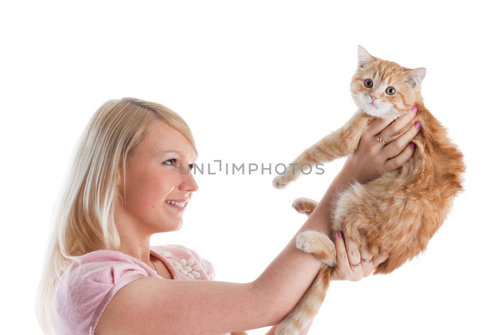 The happy young woman with a small amusing kitten on a white background.