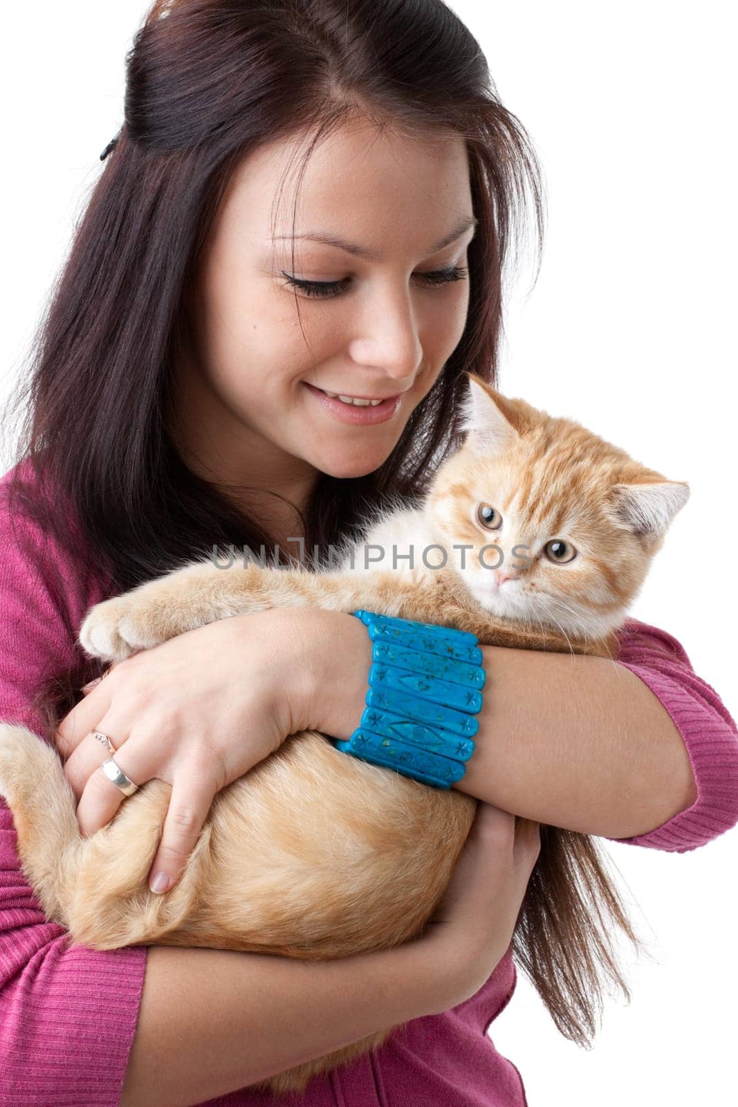 The happy young woman with a small amusing kitten on a white background.
