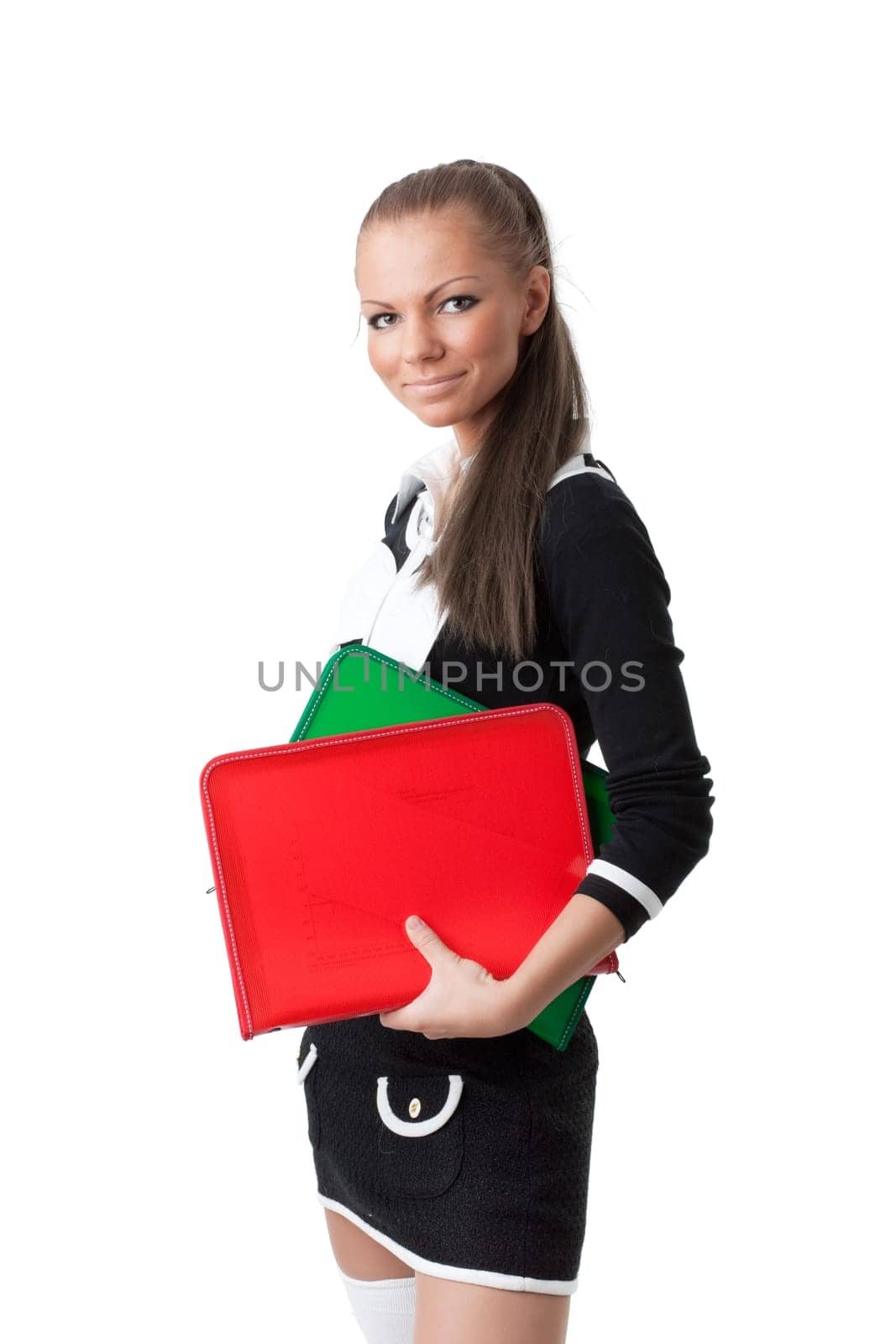 The beautiful woman stand with coloured folders on a white background.