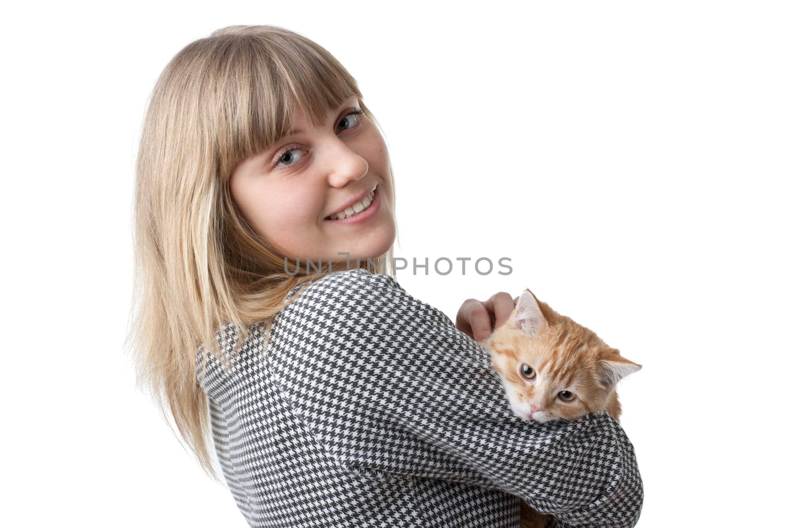 The happy young woman with a small amusing kitten on a white background.