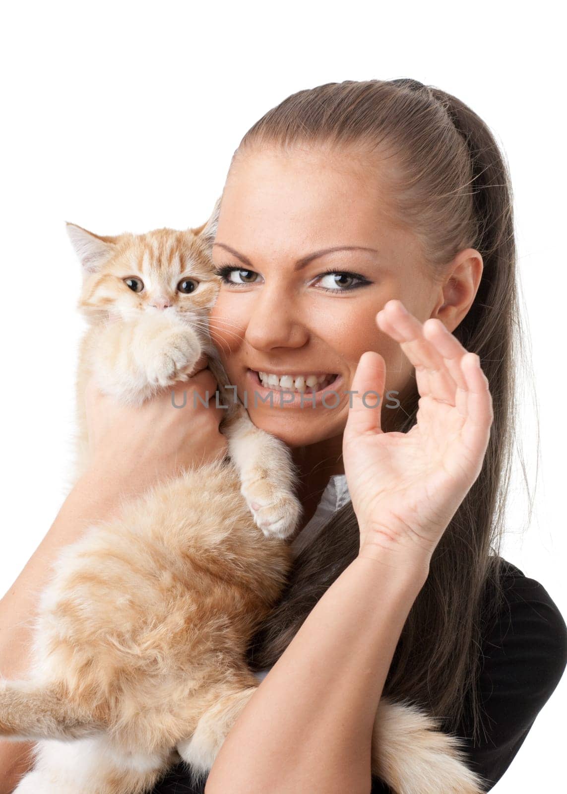 The happy young woman with a small amusing kitten on a white background.