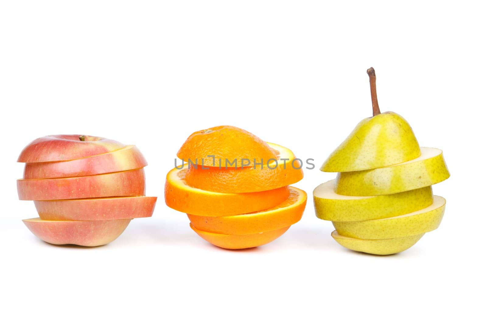 Fresh sliced fruits on a white background. Close up.