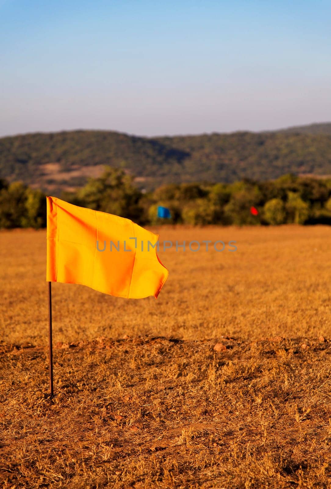 golf drive range in Mahabhaleshwar India, 100 meter colored flag markers, portrait, crop margin and empty negative areas