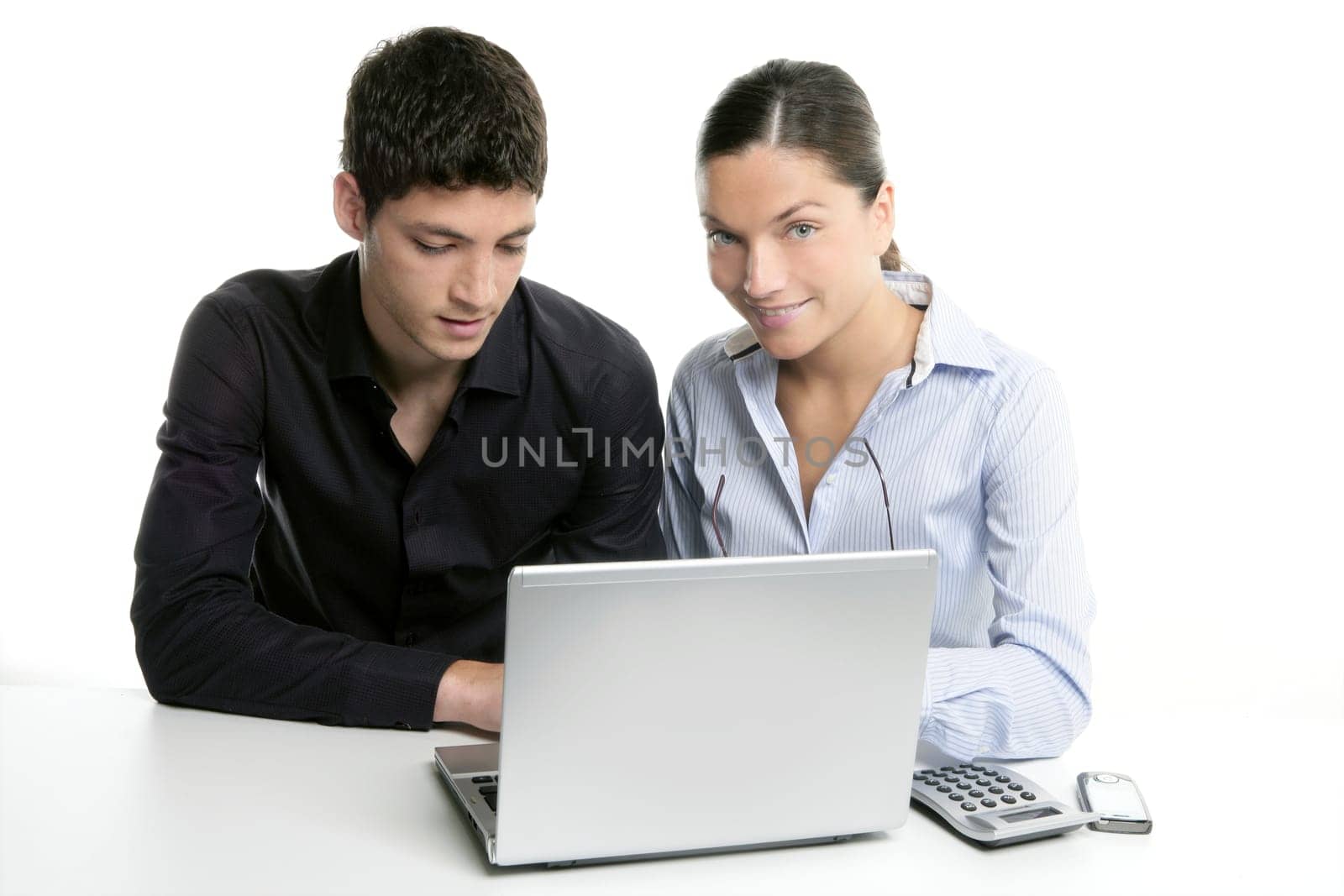 Young couple teamwork cooperation, white table with laptop