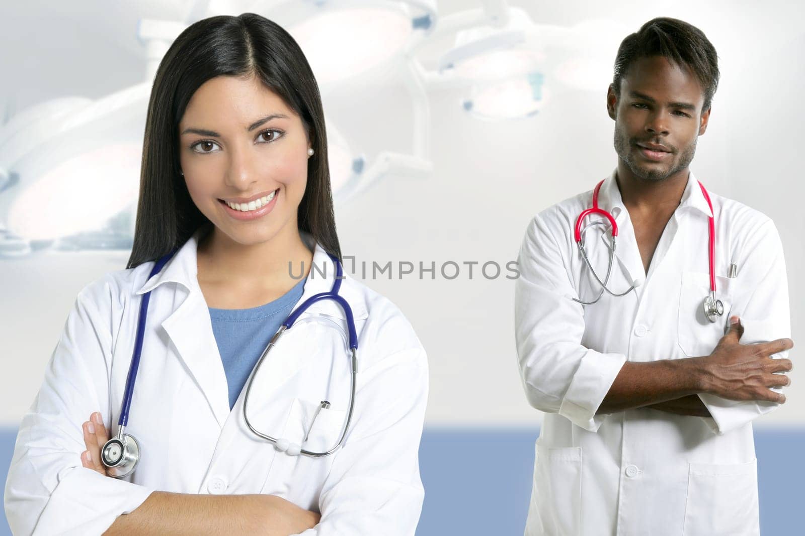 Couple of doctors asian indian woman and african man in the surgery hospital