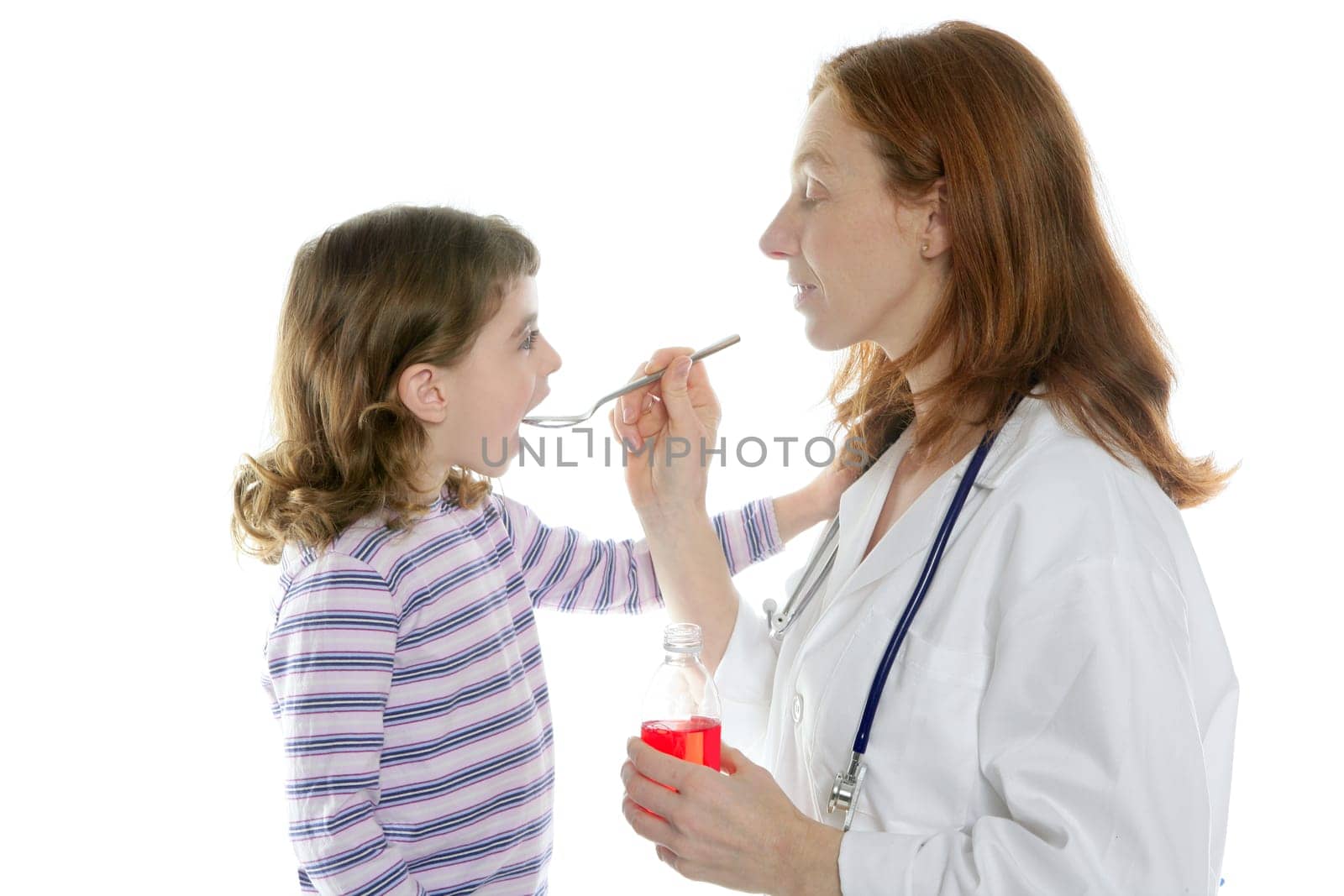 Doctor pediatrician woman spoon medicine little girl