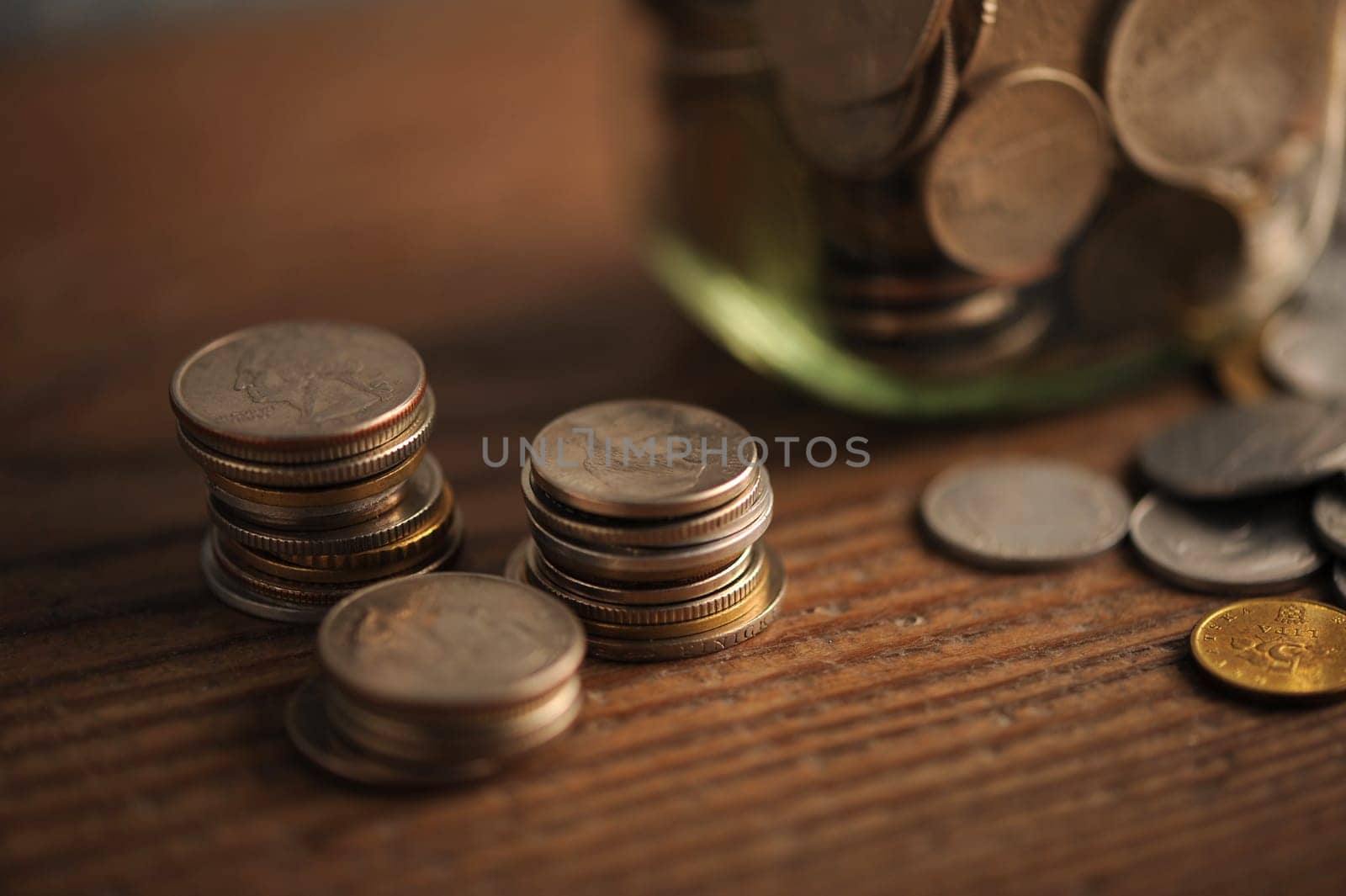 old coins on the wooden table, shallow dof