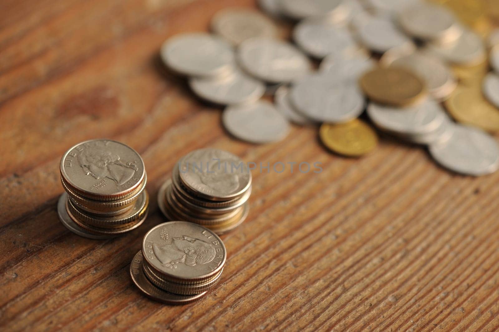 old coins on the wooden table, shallow dof