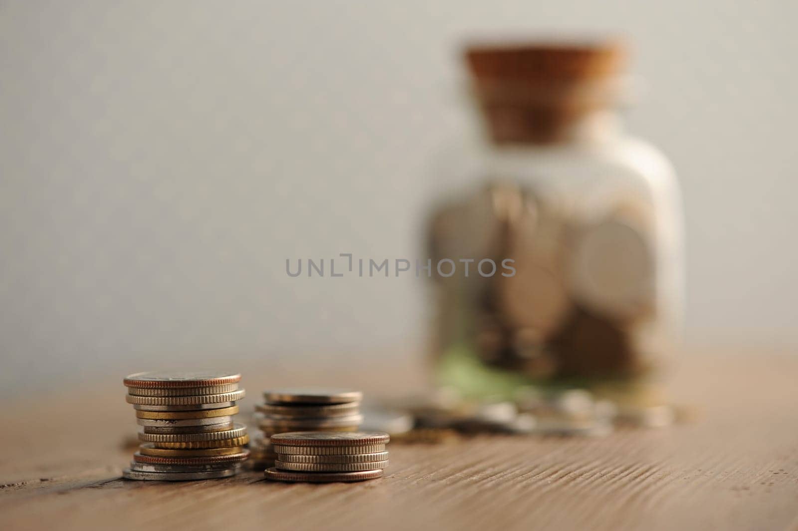 old coins on the wooden table, shallow dof