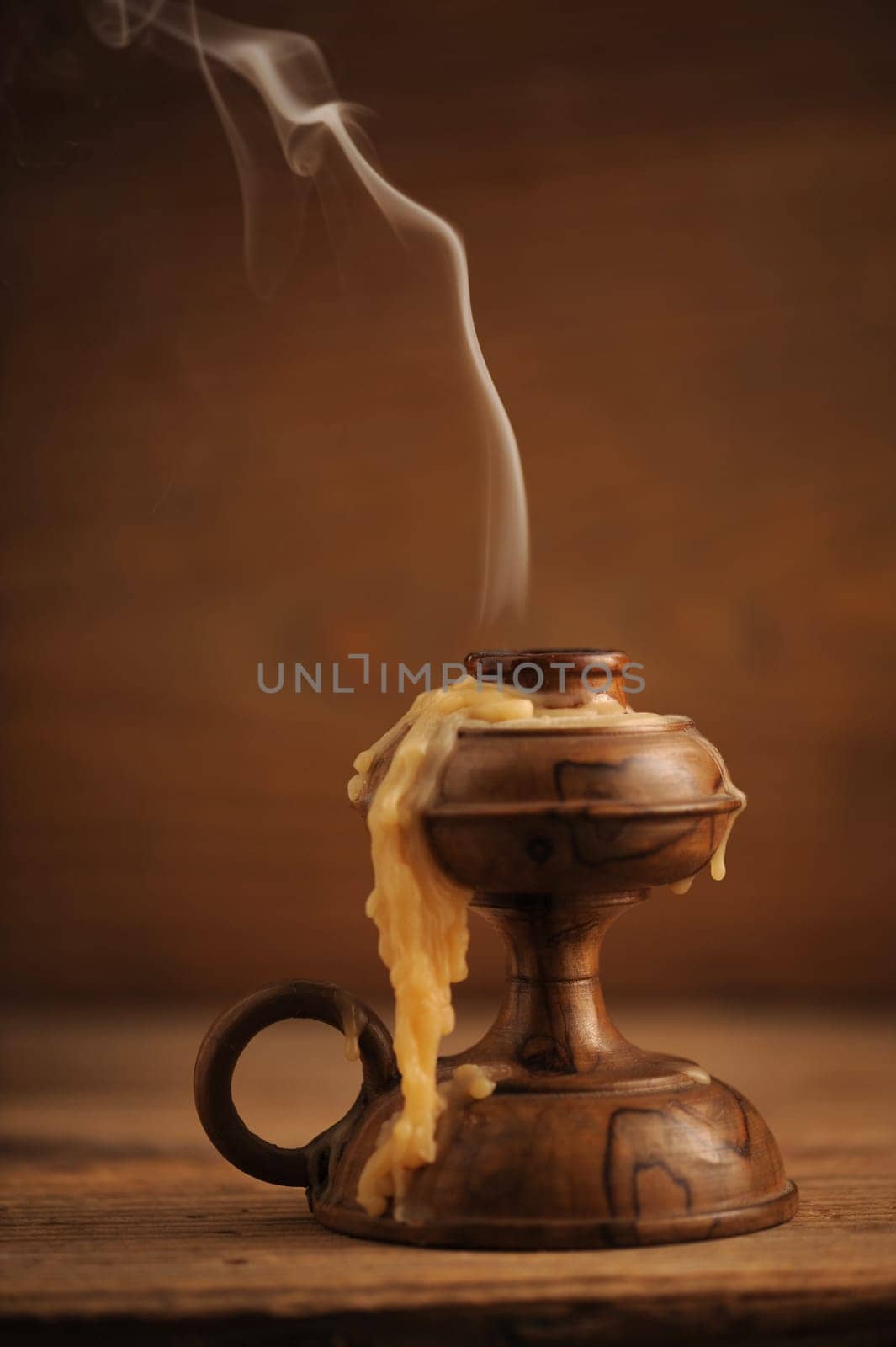 old candle on a wooden table