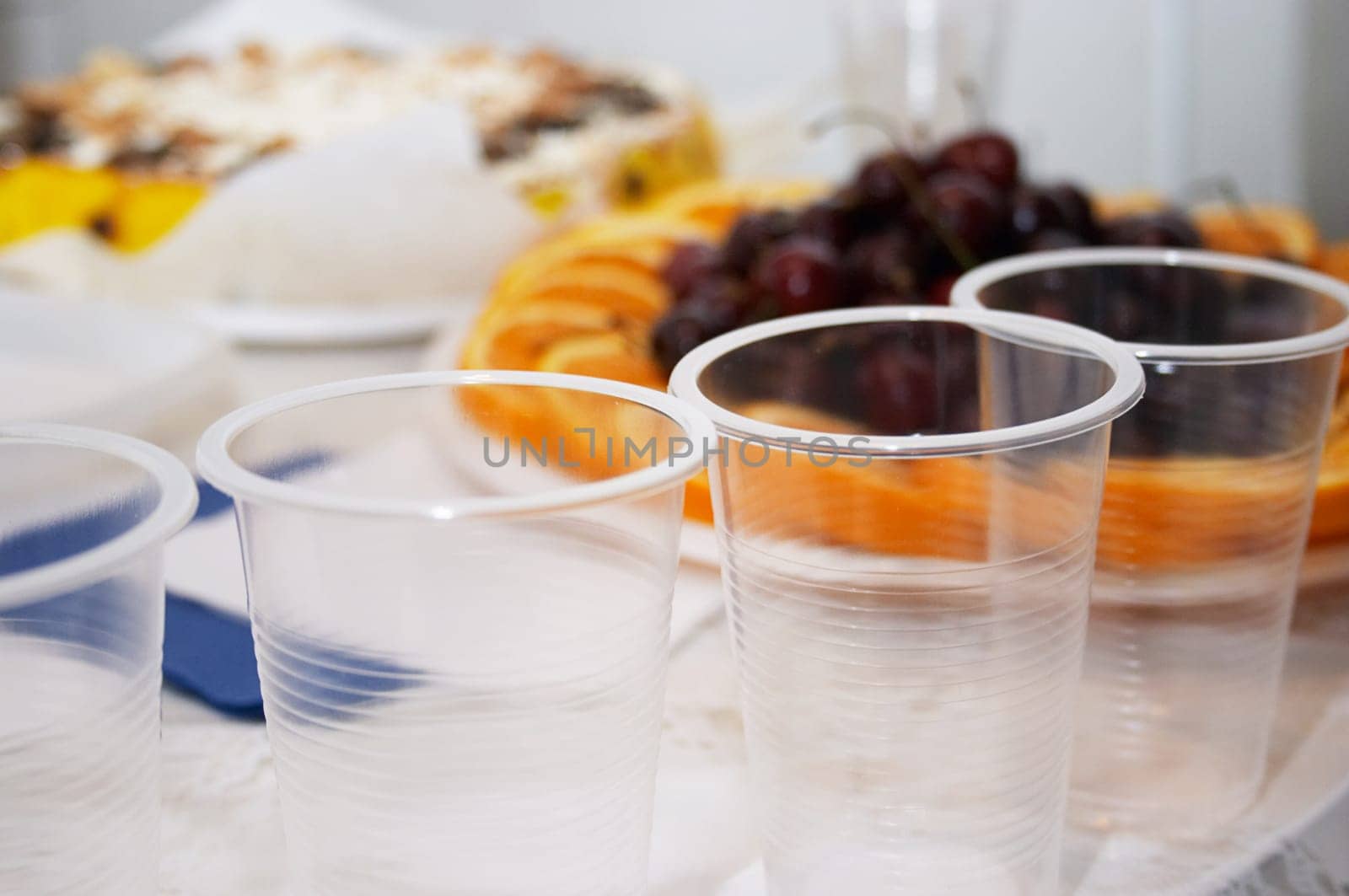 Festive smorgasbord - corporative birthday (focus on the plastic-glass)