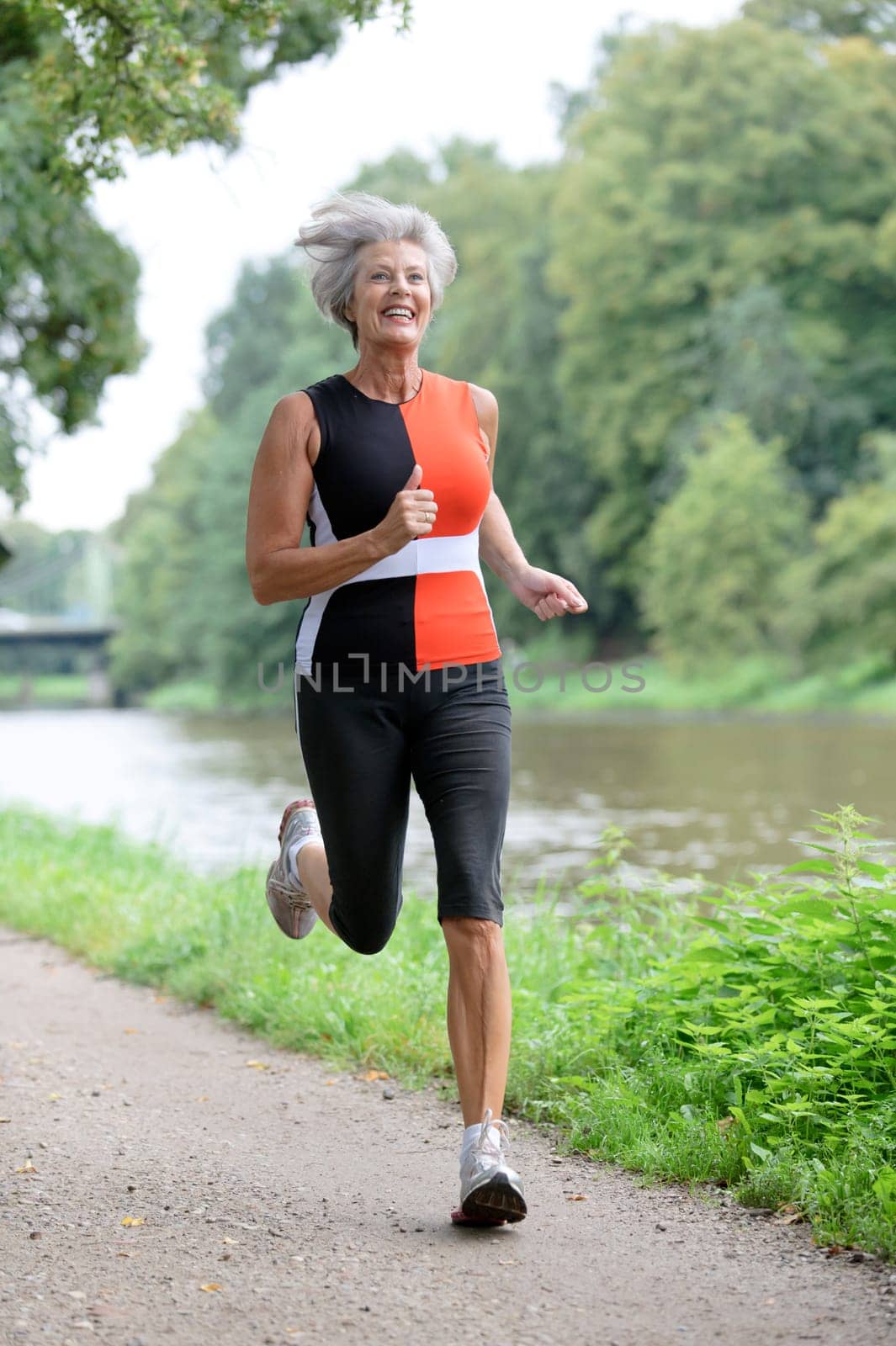 Active senior woman jogging