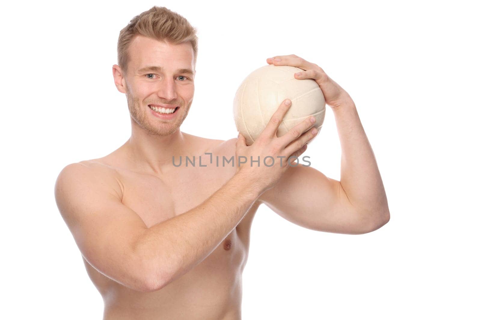 Studio shot of a young volleyball player against a white background